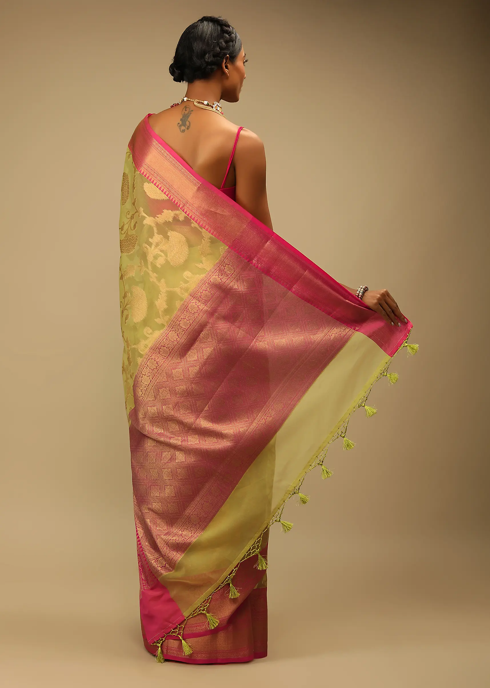 celery_green_saree_in_organza_silk_with_golden_brocade_woven3.webp