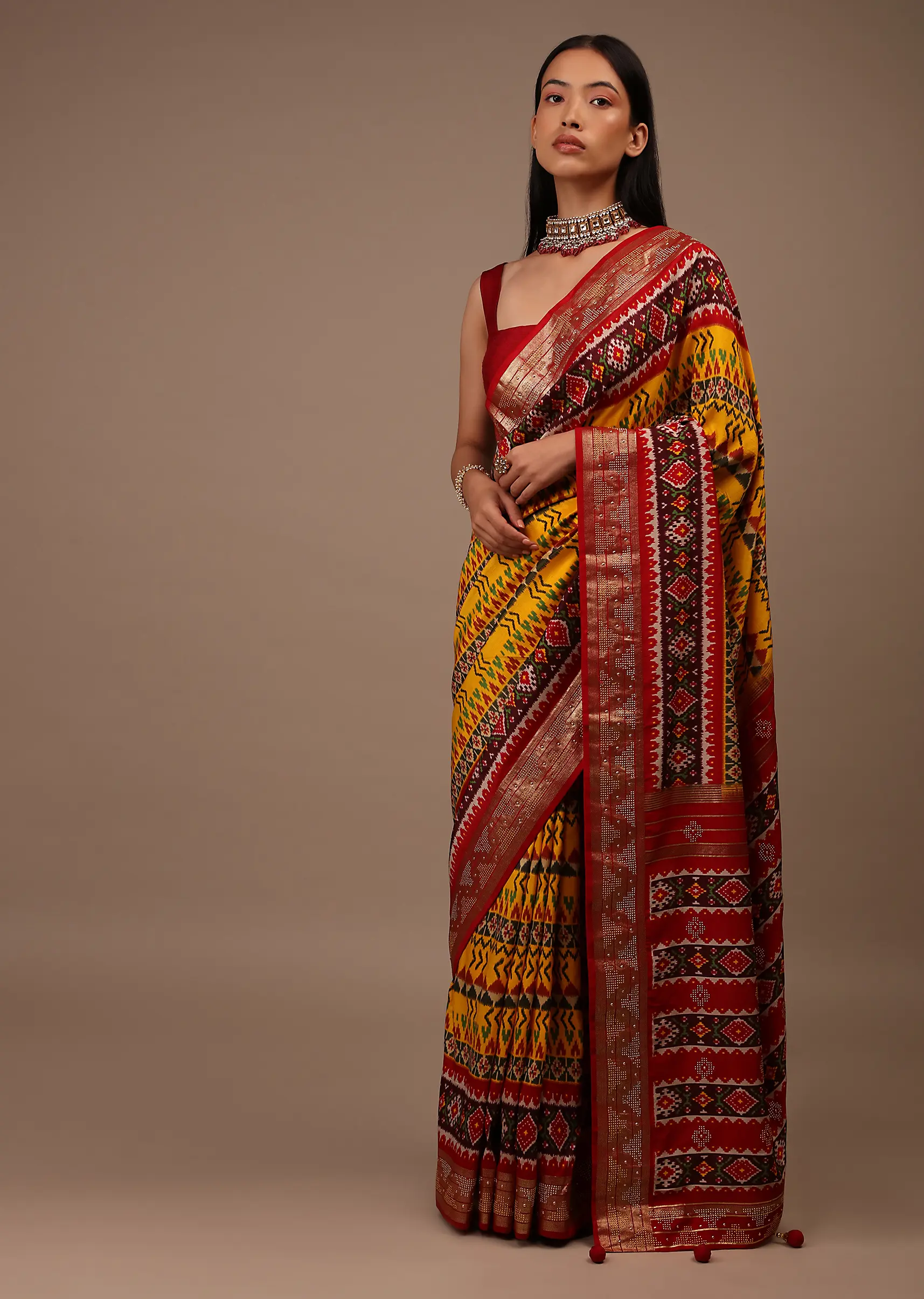 chrome_yellow_saree_in_silk_with_multi_colored_patola5.webp