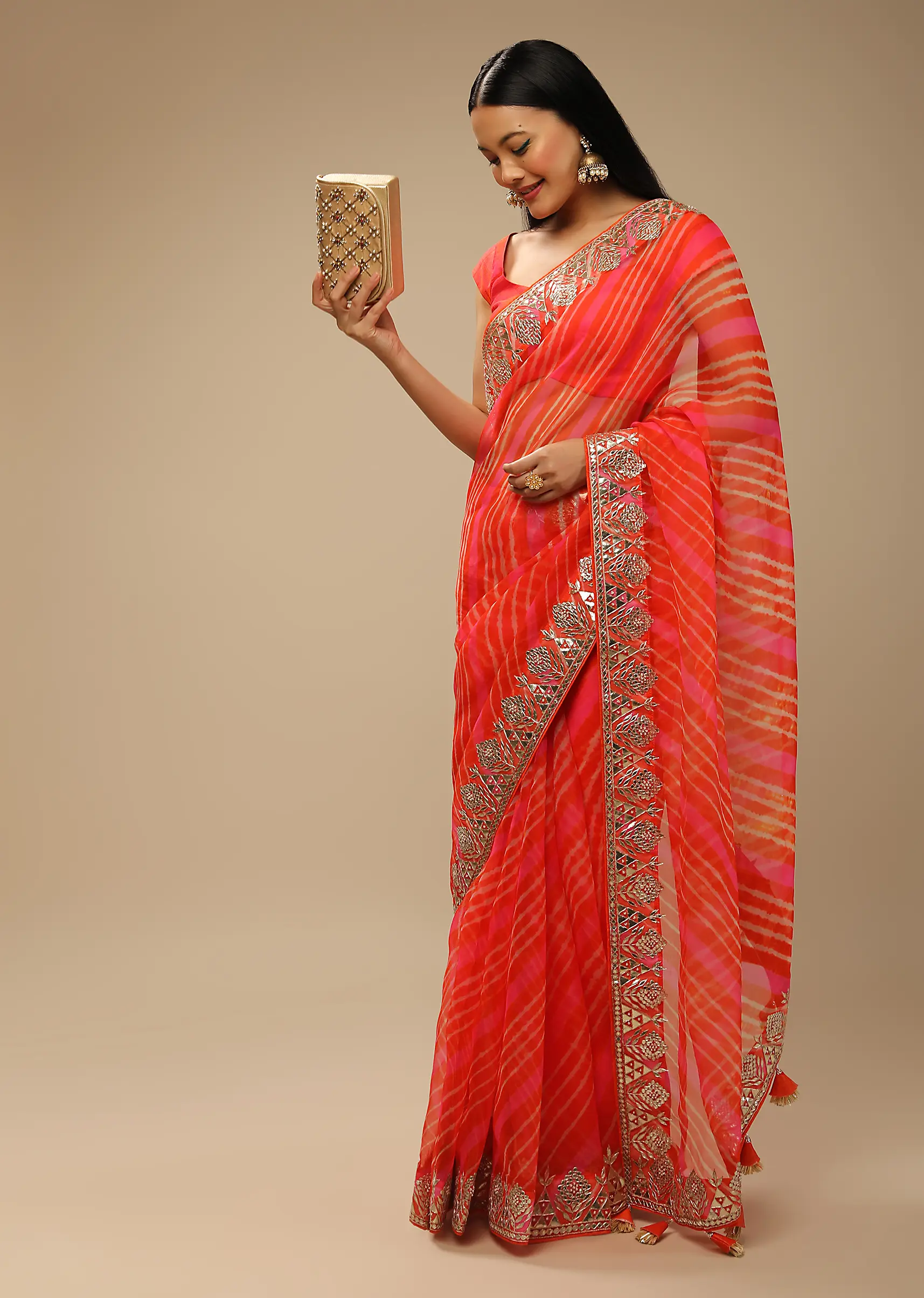orange_and_fuchsia_dual_toned_saree_in_organza_with_lehariya3.webp